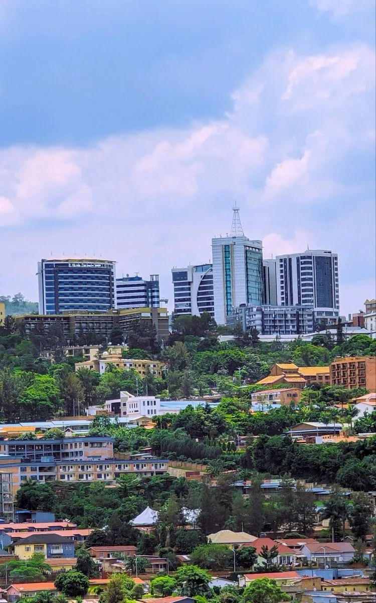 Kigali skyline rising over green hills