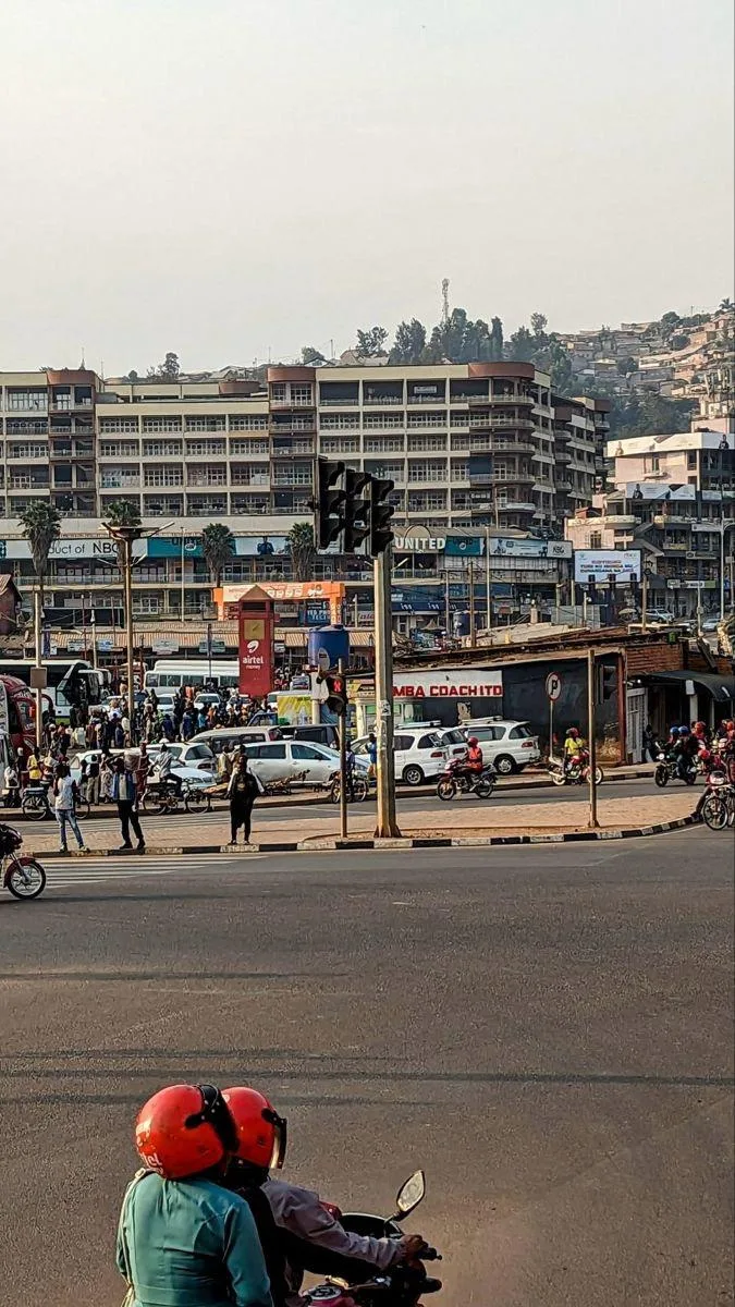Street scene in Kigali with motorbike riders and city traffic